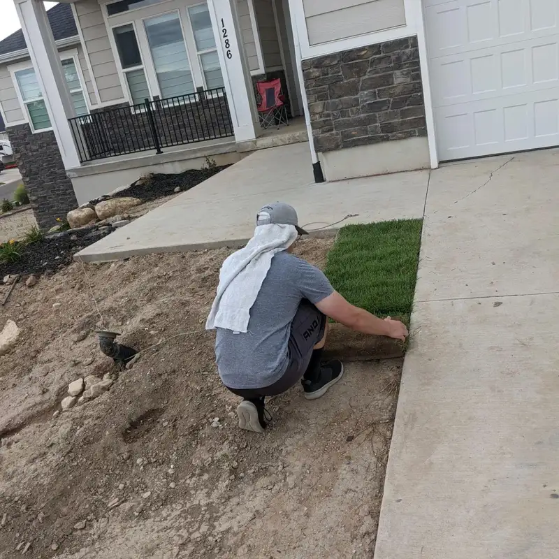 Sod installation in progress on a Utah front yard